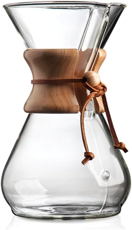 Clear borosilicate glass pour-over coffee brewer on a wooden countertop