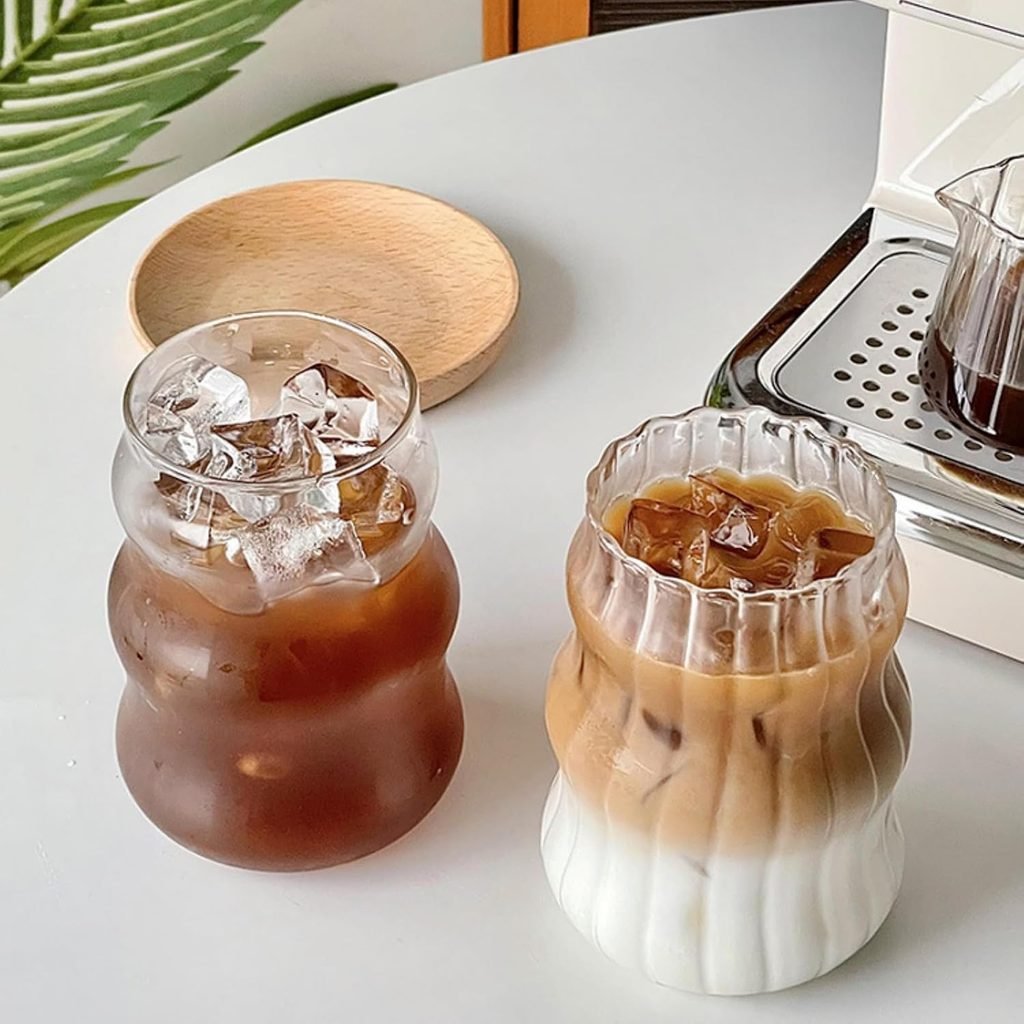 Vintage ribbed glass tumbler set filled with iced coffee and milk